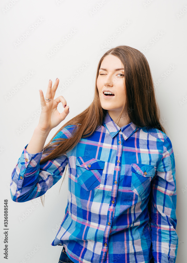 young woman with fringes showing ok young woman with fringes showing ok