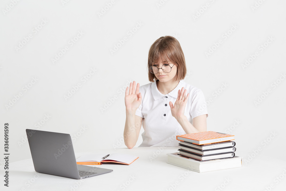 Cool happy girl goes through online training sitting at home. Remote school education on a laptop. Stay home lessons. Cool happy girl goes through online training sitting at home. Remote school education on a laptop. Stay home lessons.