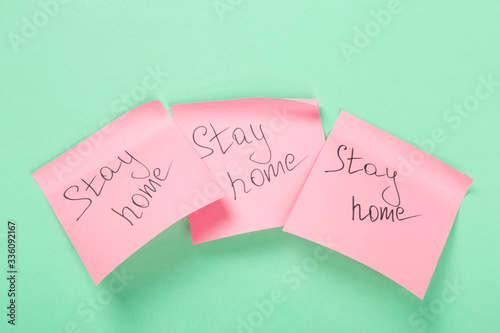 Concept of self-isolation and quarantine. Stay at home. Stickers with text on green background