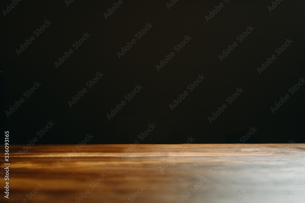 Wooden table top and dark space for background. Wooden table top and dark space for background.