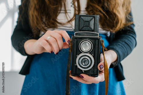 Woman photographer with old lomo camera. photo