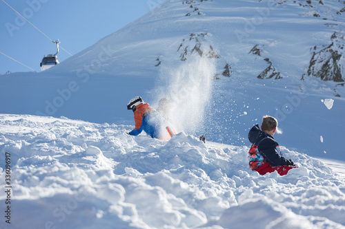 Children play in the snow and having fun photo