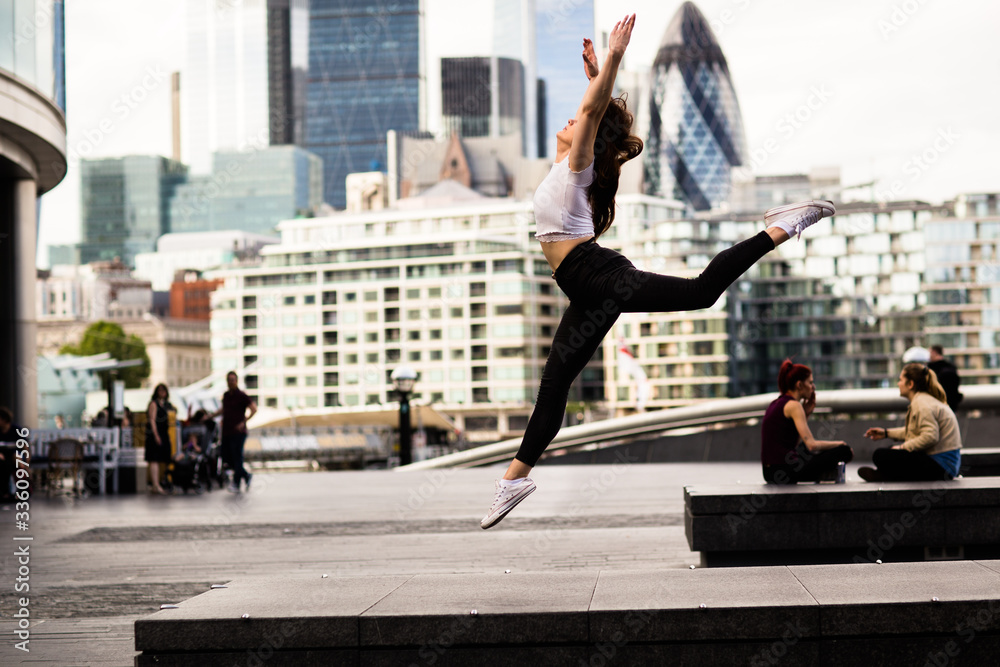 a young woman dancing in london a young woman dancing in london