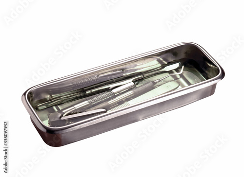 Chrome medical tray with medical instrument