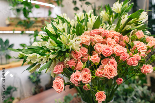 Flower shop. Interior and bouquets of fresh pink decorative roses