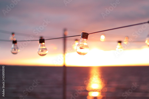 String Lights during sunset. Sea background. Abstract background.  © frecca