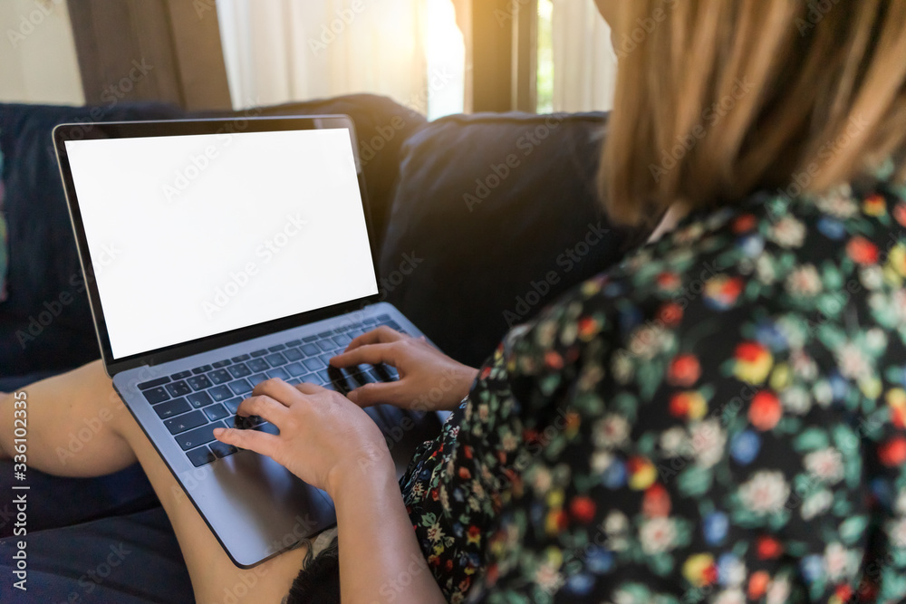 Young woman relex time working with laptop on sofa at home. Work from home concept. Young woman relex time working with laptop on sofa at home. Work from home concept.