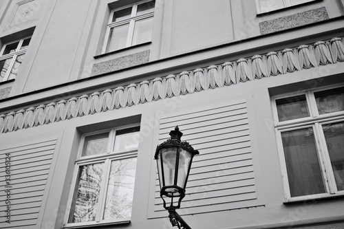 Vintage black street lantern hanging on the wall (Prague, Czech Republic, Europe)