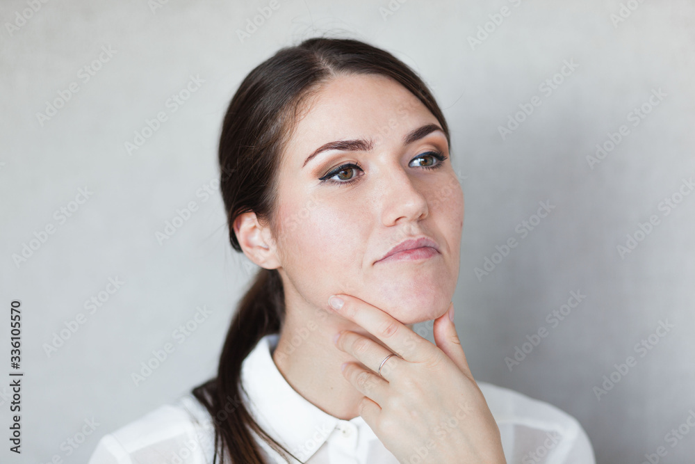 Portrait of a beautiful young woman thinking Portrait of a beautiful young woman thinking