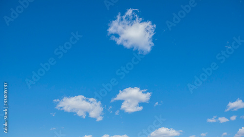 clear blue sky with white clouds on a clear day