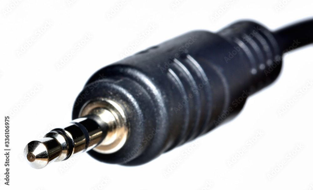 Close-up of 3.5mm jack connector isolated on white background. Close-up of 3.5mm jack connector isolated on white background.