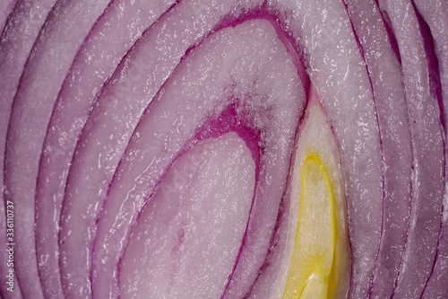 Natural background.Beautiful cut texture of purple onion.Wet texture of onion.Abstract textured background.Close-up, horizontal, cropped shot, top view.