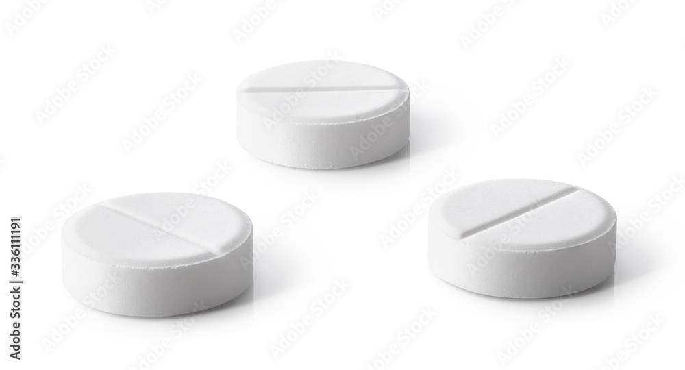 Close-up of white round pills Close-up of white round pills