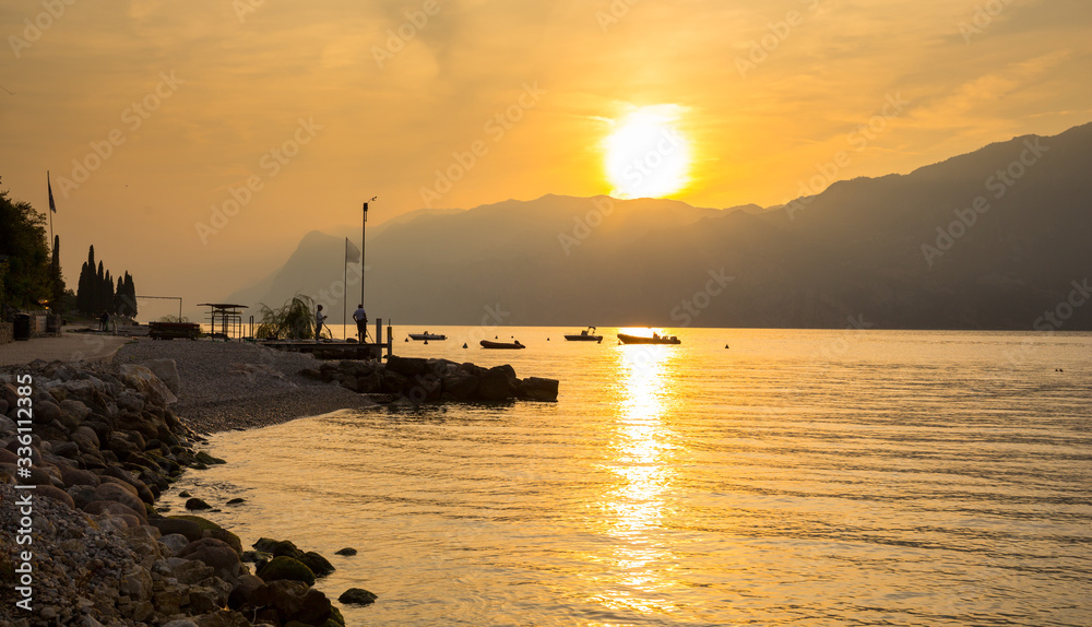 Beautful coastline of Garda lake at sunset, northern Italy