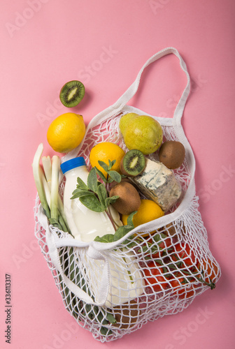 Zero waste cconcept. Package-free food shopping. Eco friendly natural bag with organic fruits and vegetables. Sustainable lifestyle concept. Plastic free items. Reuse, reduce, refuse. Top view.