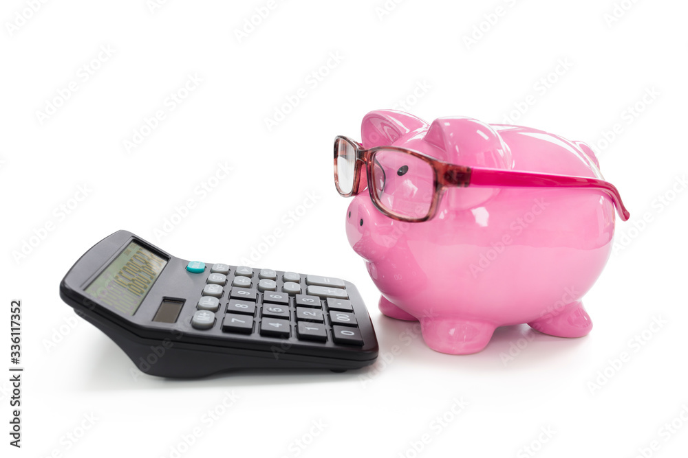 Piggy bank and calculator concept for saving, accounting, banking and business account Piggy bank and calculator concept for saving, accounting, banking and business account