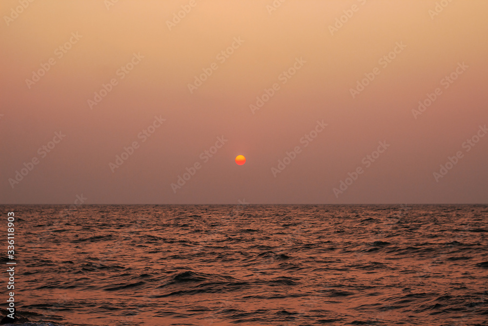 beautiful sunset over the calm ocean in Sri Lanka