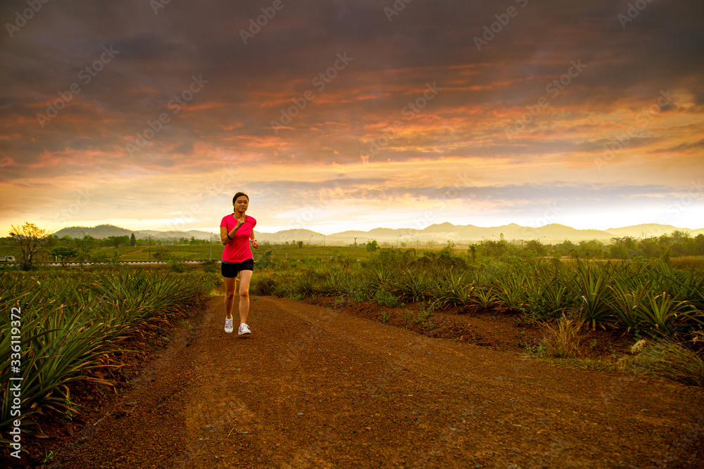 Asian woman jogging