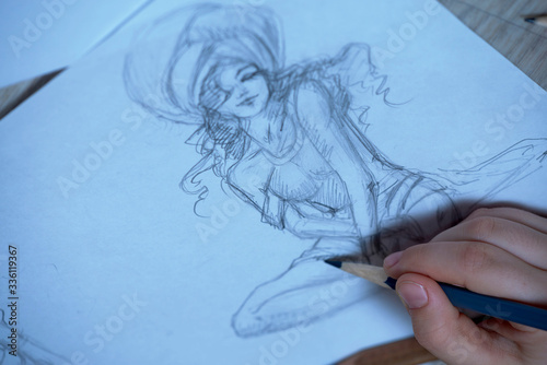 Sketches, sketching on white paper with a simple pencil. Colour pencils.

