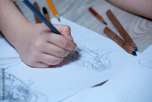 Sketches, sketching on white paper with a simple pencil. Colour pencils.
