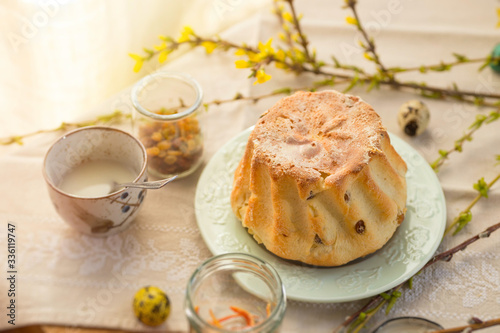 Polish Easter babka yeast cake. Glazing traditional baba raisin bread.