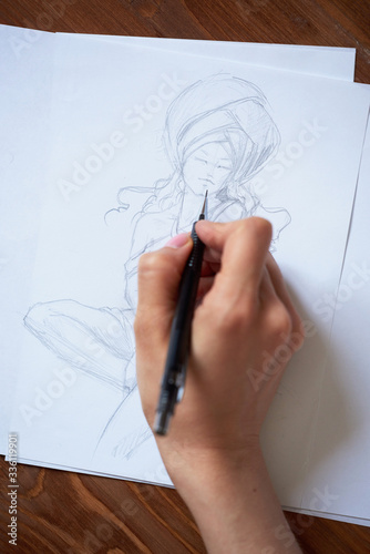 Sketches, sketching on white paper with a simple pencil. Colour pencils.
