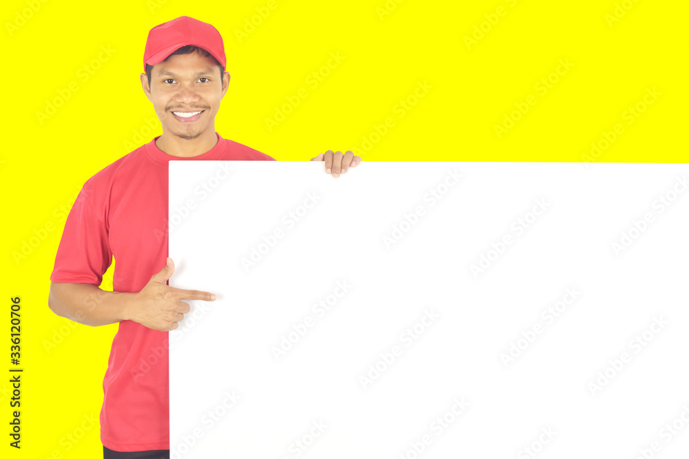 Delivery man holding big white empty blank billboard with copy space, place for text image. Service concept. Delivery man holding big white empty blank billboard with copy space, place for text image. Service concept.