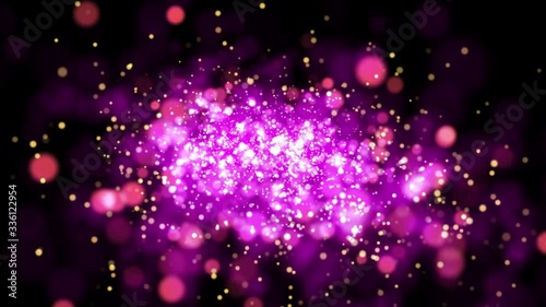 Pink shiny sparkling particles move. It is bright festive background with glittering particles depth of field bokeh 