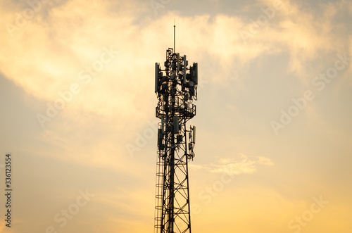 Communication tower during sunset, Silhouettes telecommunication tower on sunset background