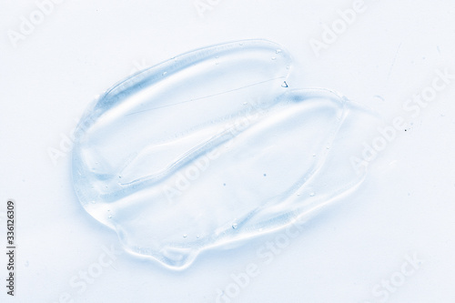 Transparent liquid gel cream smudge on white background © VERSUSstudio