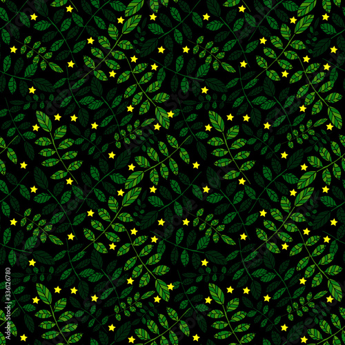 Vector seamless pattern of green ash leaves on  black background.   Summer and spring design element. with shiny yellow stars , trendy theme  for textiles and other surfaces