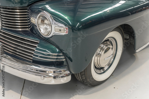 chrome plated front bumper and light of vintage car, Wanaka, New Zealand