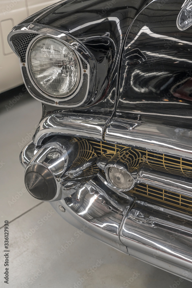 chrome plated front lights and bumper of vintage car, Wanaka, New Zealand