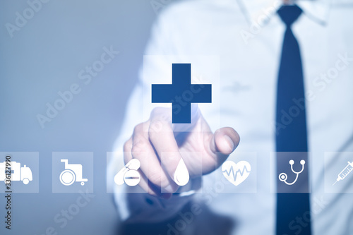 Health insurance concept, Businessman pressing Healthcare Medical icon