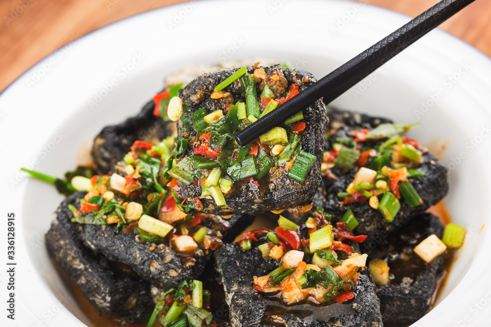Stinky tofu is a Chinese form of fermented tofu that has a strong odor. Fried Hunanstyle stinky