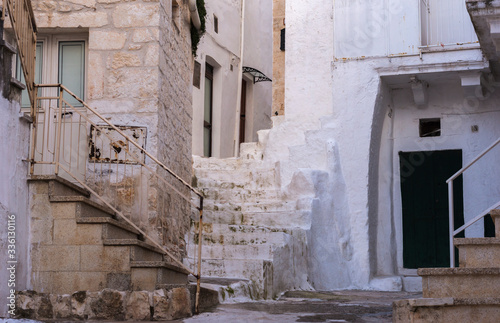 Old narrow town street in historic center of Ostuni, Italy