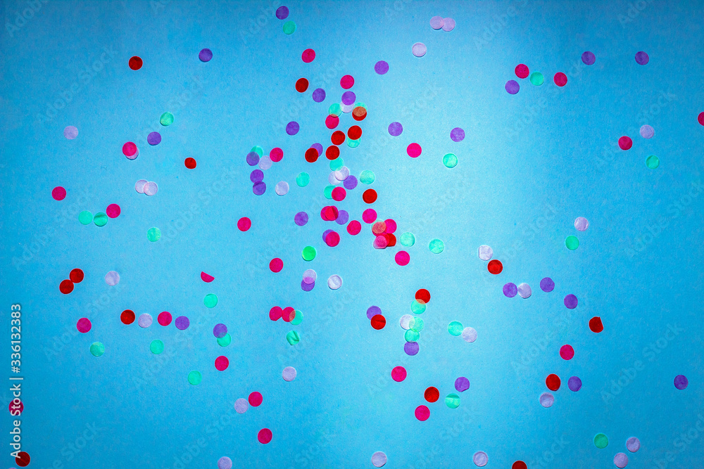 Colorful confetti on a blue background Colorful confetti on a blue background