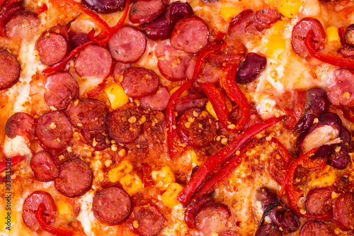 Pizza Mexico macro, with kapia and chili peppers, top view photo