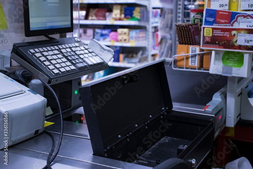 The store cash desk is open and there is nothing in it. Shop robbery