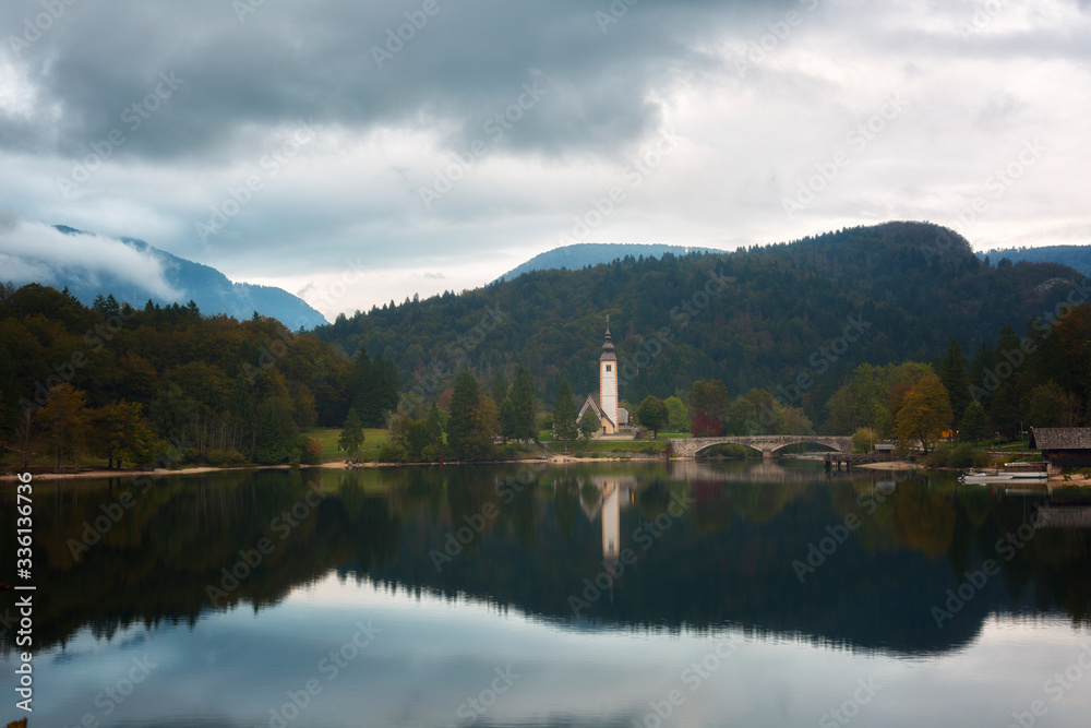 Church of Sv. John the Baptist and a bridge by the Bohinj lake, Slovenia Church of Sv. John the Baptist and a bridge by the Bohinj lake, Slovenia
