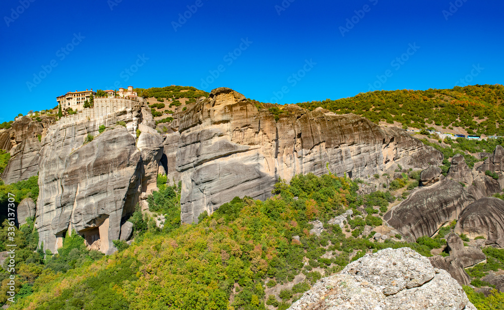 Meteora monastery on Corfu mountains with greenery.