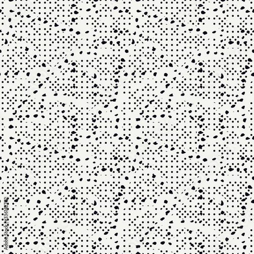 Dotted seamless pattern. Grunge print. Ink spray background. Irregular chaotic black blots, paint spots, drips, splashes