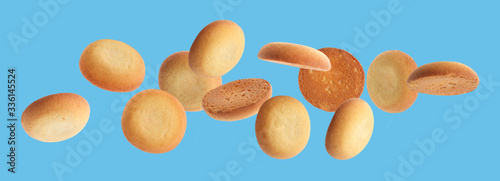 Set of falling delicious shortbread cookies on blue background. Banner design