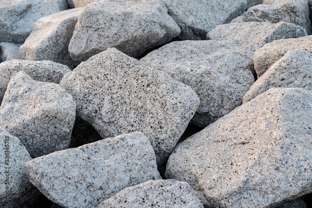 Close up. rock stone breakwater at the pier on the beach. Close up. rock stone breakwater at the pier on the beach.