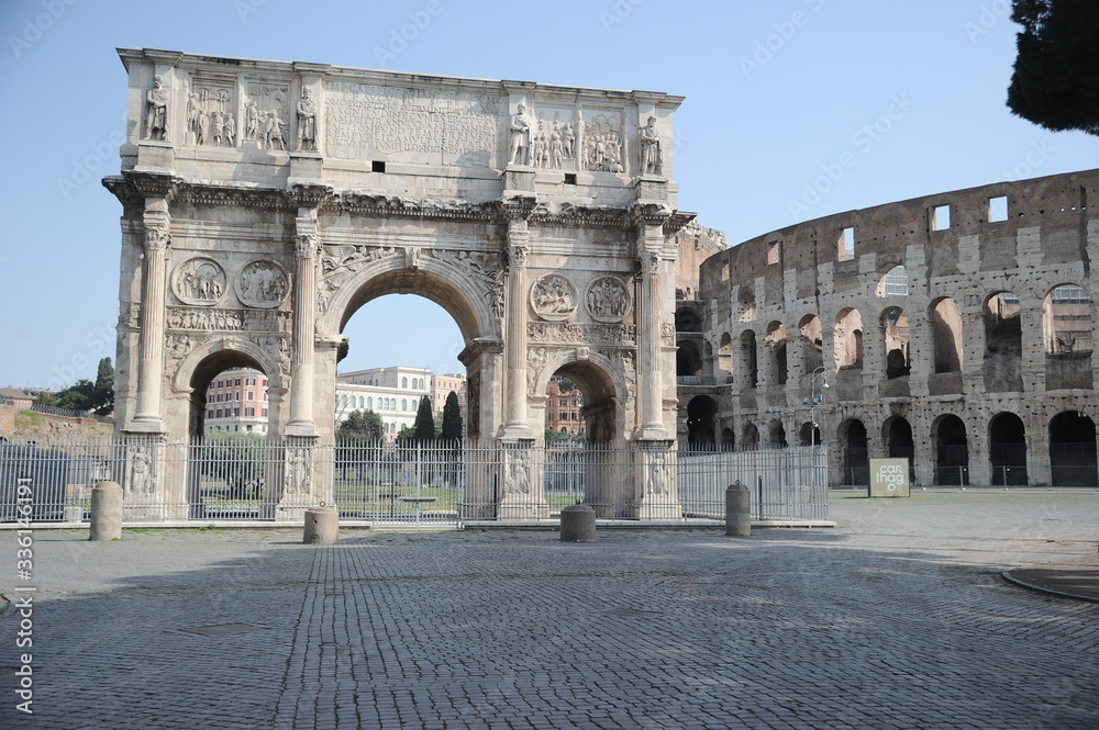 Rome, Italy-29 Mar 2020: Popular tourist spot Colosseum and Arch of Constantine is empty following the coronavirus confinement measures put in place by the governement, Rome, Italy