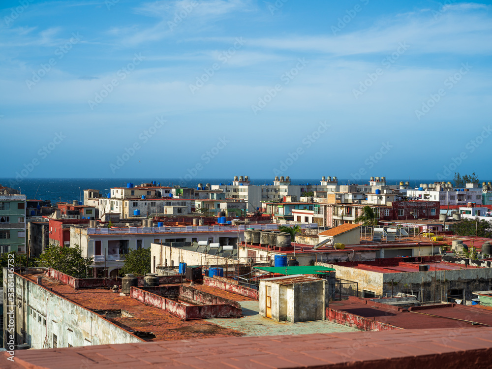 View of rooftops of houses in sunrise in Havana, Cuba