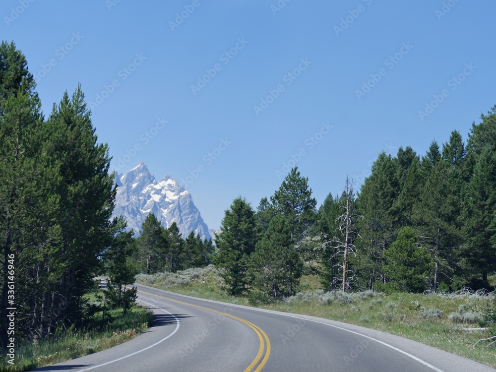Scenic view of Grand Teton mountain ranges through winding roads at the Grand Teton National Park, Wyoming. Scenic view of Grand Teton mountain ranges through winding roads at the Grand Teton National Park, Wyoming.