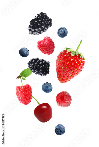 Set of falling sweet berries on white background