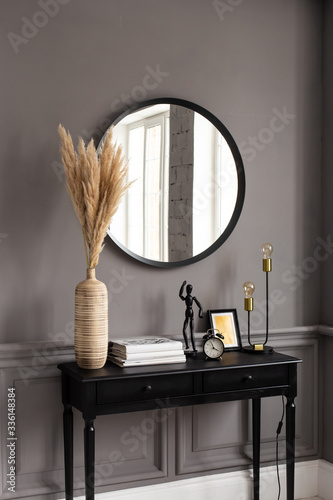 Wallpaper Mural Console with a mirror on a background of a gray wall in a modern interior. Torontodigital.ca