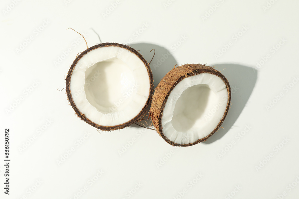 Halves of coconut on white background, top view Halves of coconut on white background, top view